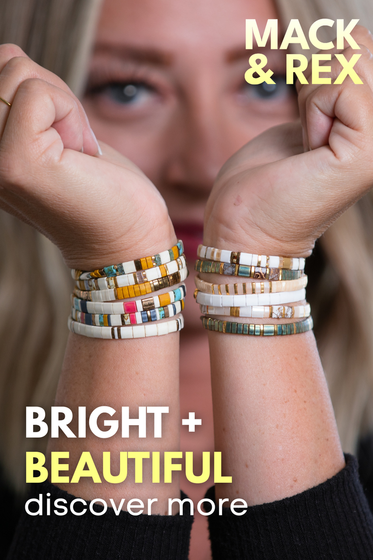 Close up of a woman's wrists adorned with colorful bracelets