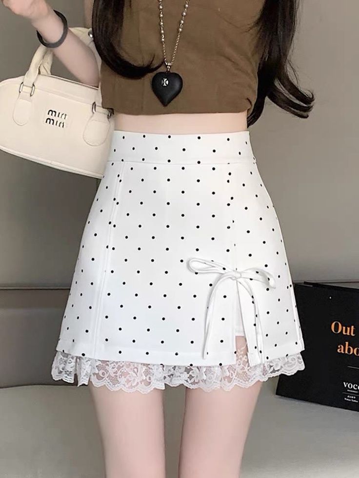 Woman wearing a polka dot skirt with lace trim and a brown crop top
