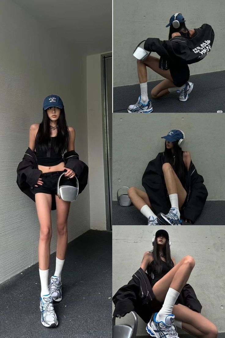Woman in a baseball cap, crop top, and shorts posing indoors