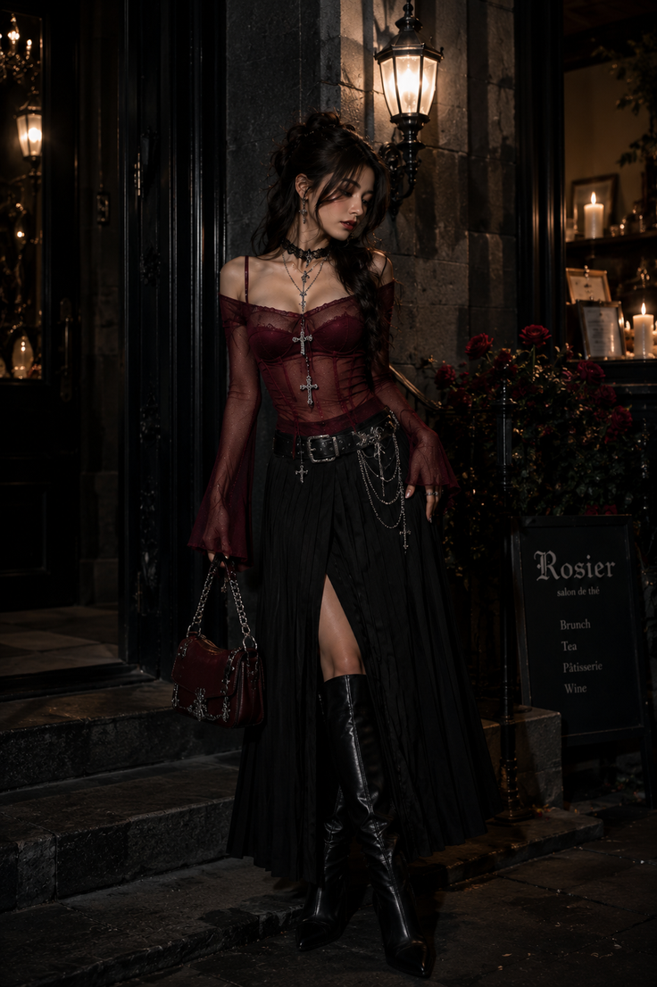 Woman in gothic attire with a sheer top and long skirt at night