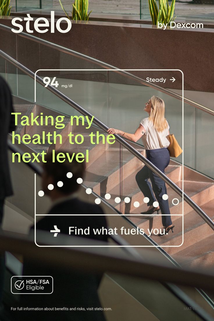 Blonde woman in business attire walking up modern indoor stairs