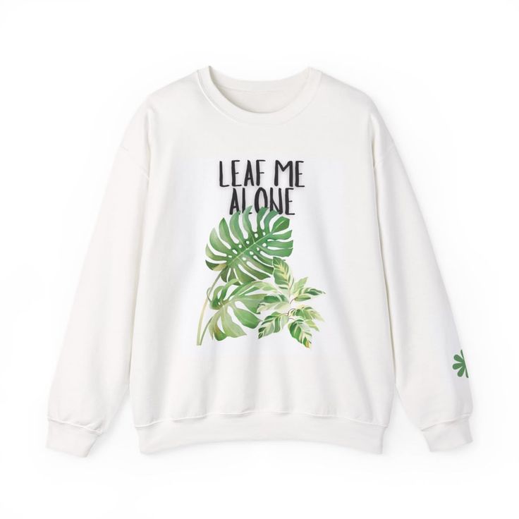 White sweatshirt with 'Leaf Me Alone' text and monstera leaf graphic