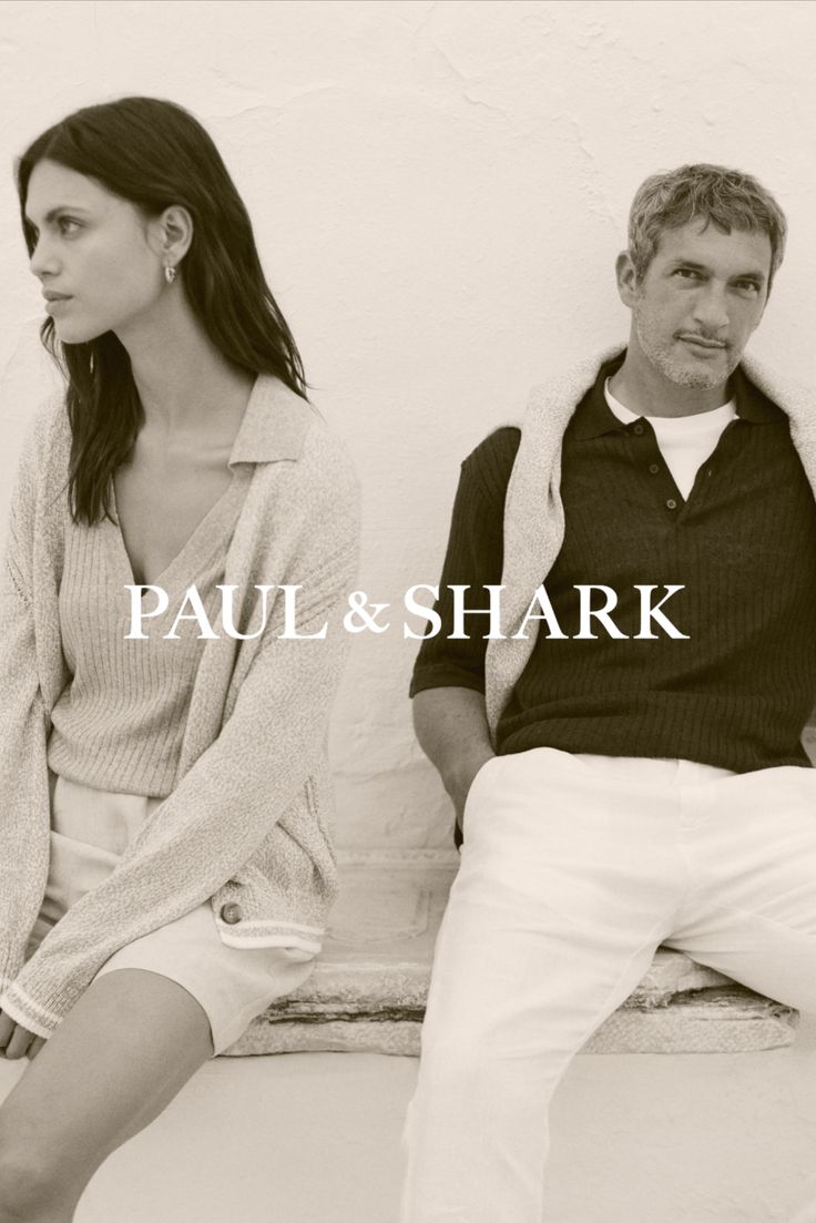 Man and woman in casual clothing sitting outdoors with a sepia tone
