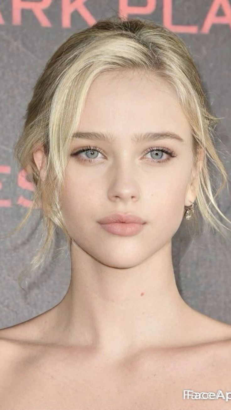 Blonde woman with blue eyes in a close-up portrait