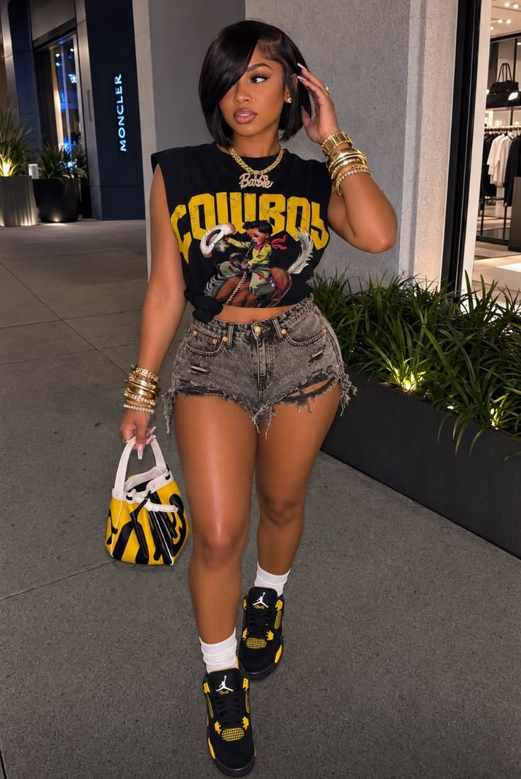Woman with short hair wearing a crop top and denim shorts outdoors