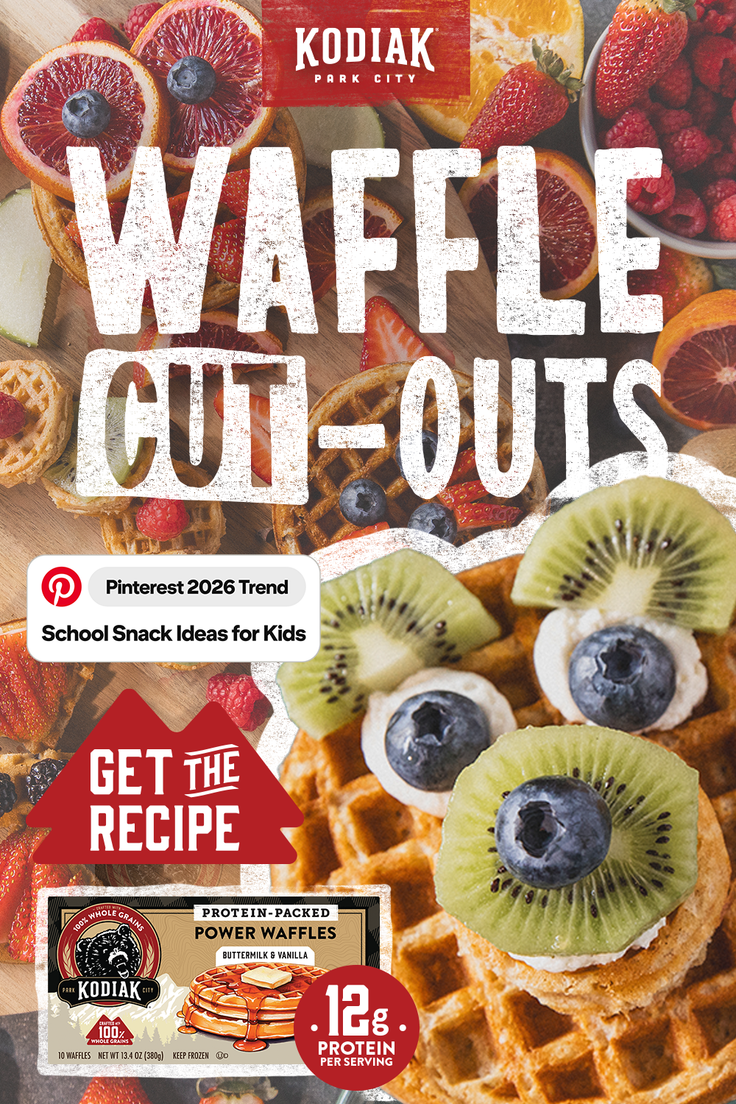 Waffles with various fruit toppings including kiwi, blueberries, and blood oranges