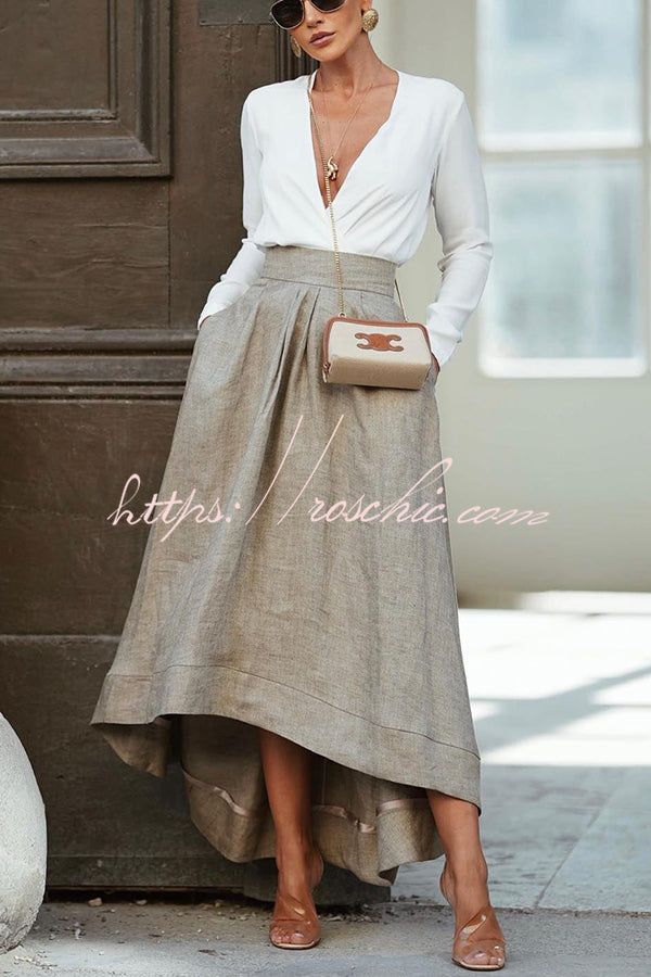 Woman in a white blouse and long skirt with sunglasses and jewelry outdoors