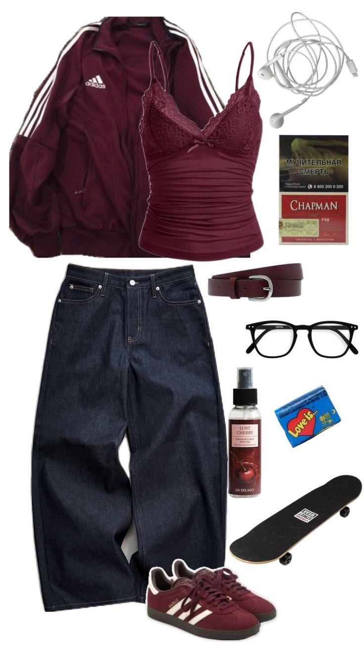 Flat lay of a maroon jacket, dark wash jeans, and various accessories