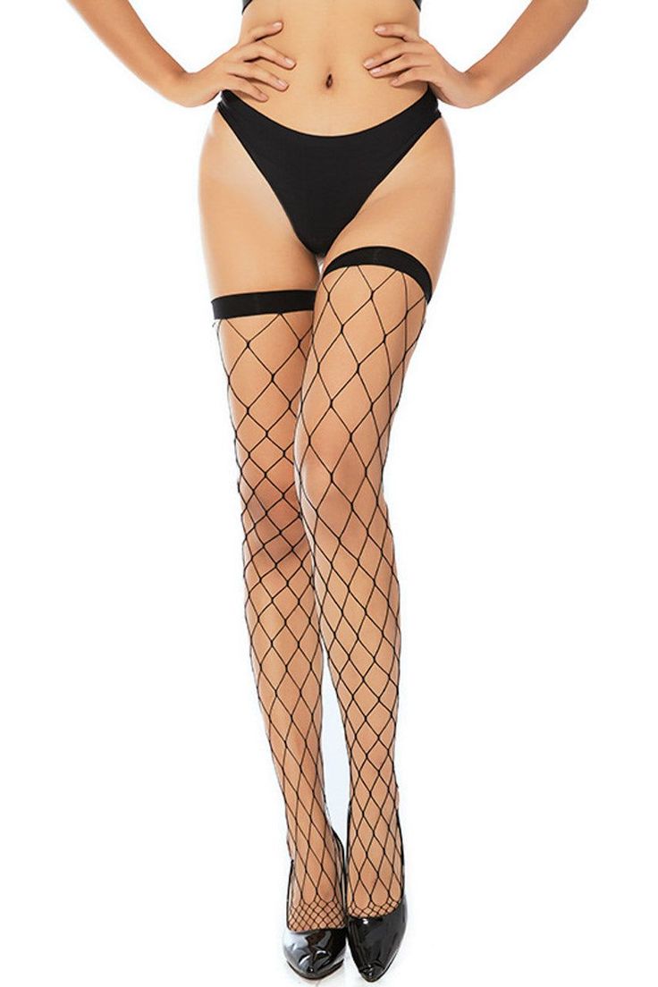 Woman in black underwear, fishnet stockings, and high heels