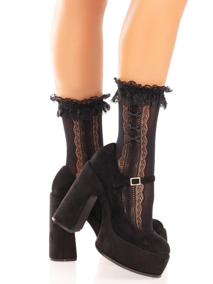 Legs wearing black lace socks with ruffles and platform heels
