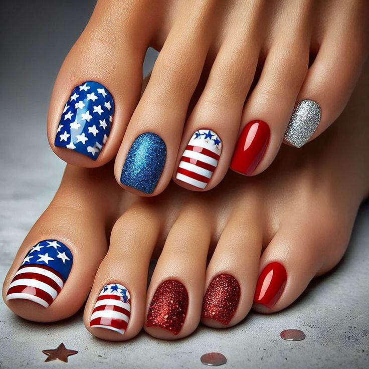 Feet with patriotic themed pedicure featuring stars, stripes, and glitter