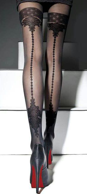 Woman's legs in black patterned stockings and high heels with red soles