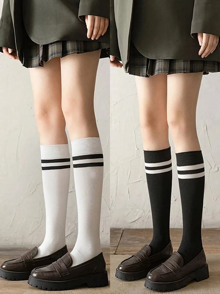 Two people in school uniforms with knee-high socks and loafers