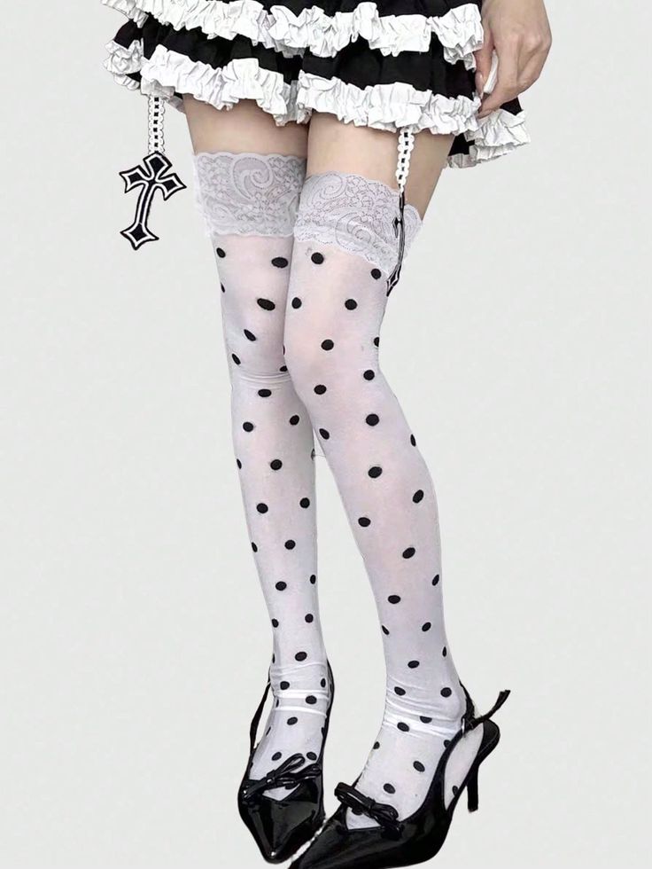 Person wearing polka dot stockings with a ruffled skirt and high heels