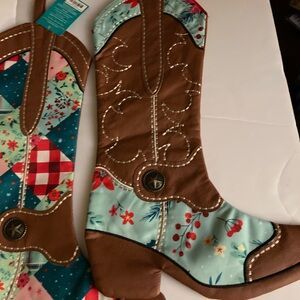 Two decorative cowboy boots with quilted floral and patchwork designs
