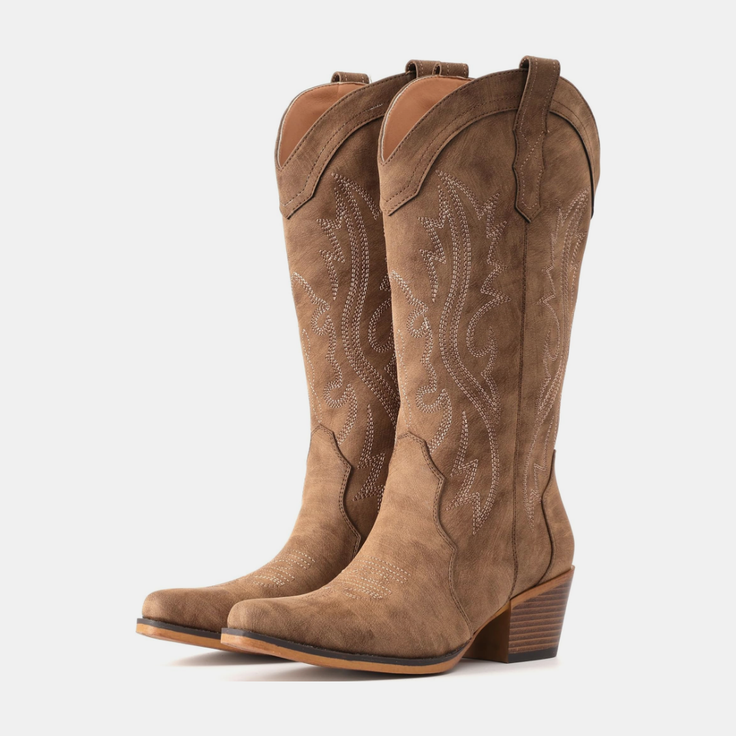 Pair of brown cowboy boots with embroidered designs and block heels
