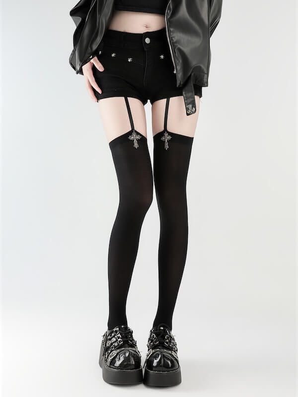 Person in black shorts, thigh-high stockings with garter straps, and platform shoes