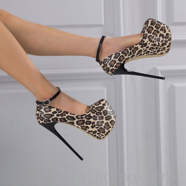 Pair of leopard print high heels with ankle straps on legs
