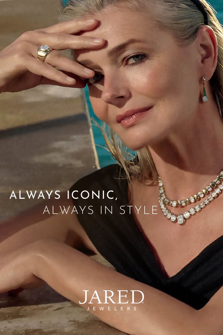 Woman with blonde hair wearing jewelry by a swimming pool