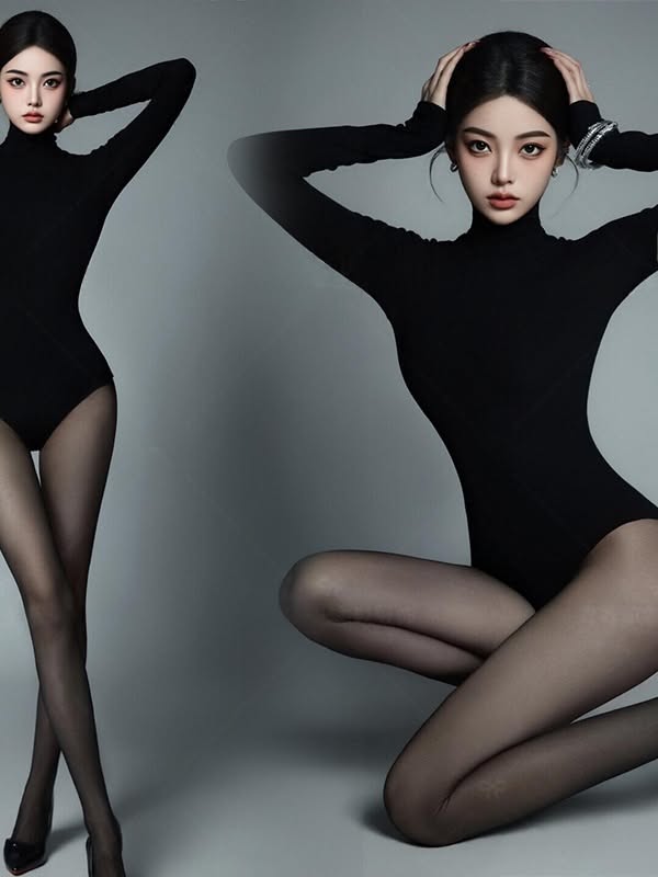 Woman in a black bodysuit and pantyhose posing in a studio