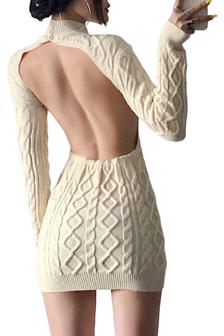 Woman in a backless knit dress with long sleeves and hoop earrings