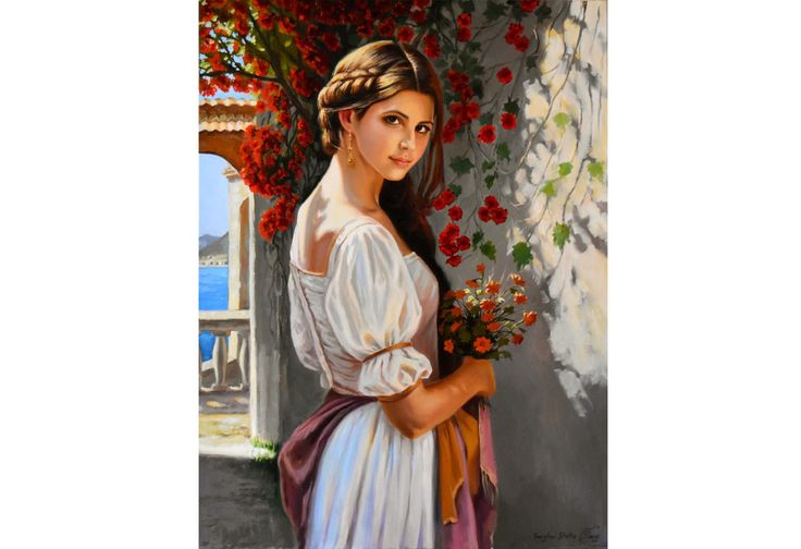Woman with braided hair in a white dress holding flowers on a balcony overlooking the sea