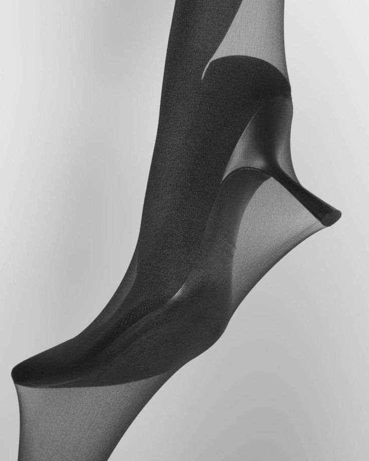 Black stockings and high heels in a monochrome studio shot