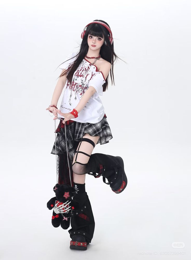 Woman with long black hair and red headphones in gothic-style clothing