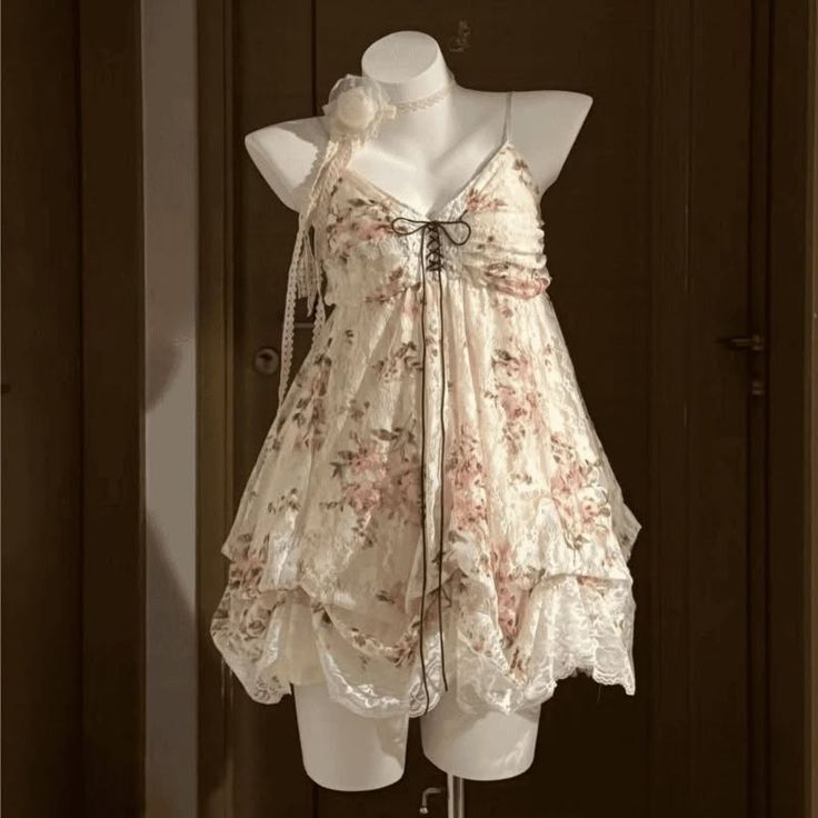 Lace floral dress with ruffles and a choker on a mannequin