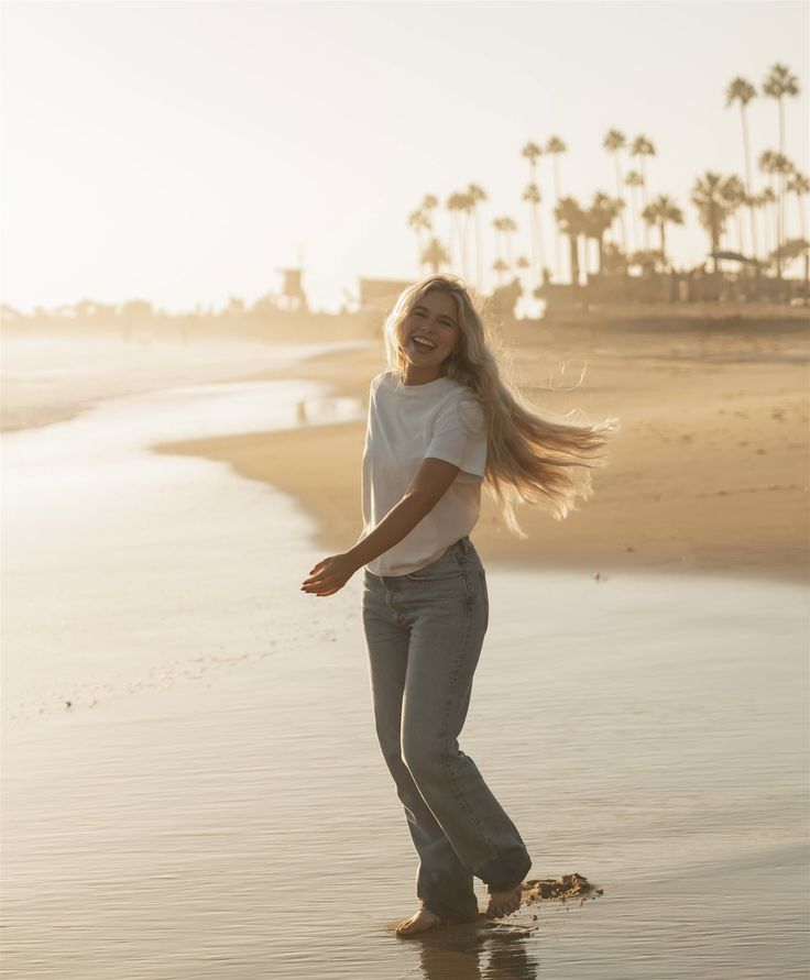Woman with long blonde hair on a beach at golden hour