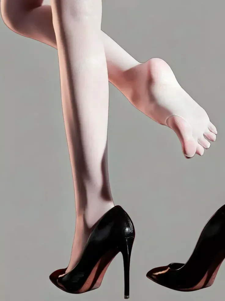Pair of legs with one foot in a black high heel and the other bare