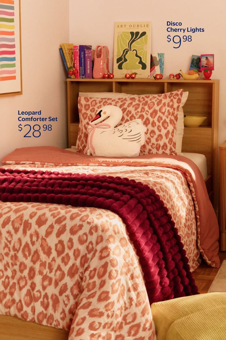 Bedroom with leopard print bedding, a swan pillow, and a wooden headboard with decor