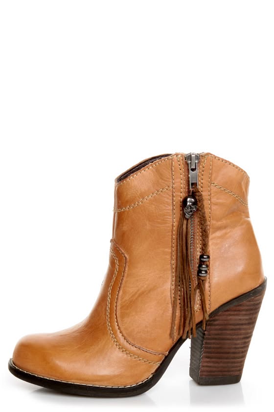 Tan leather ankle boot with a chunky heel and skull charm on a white background