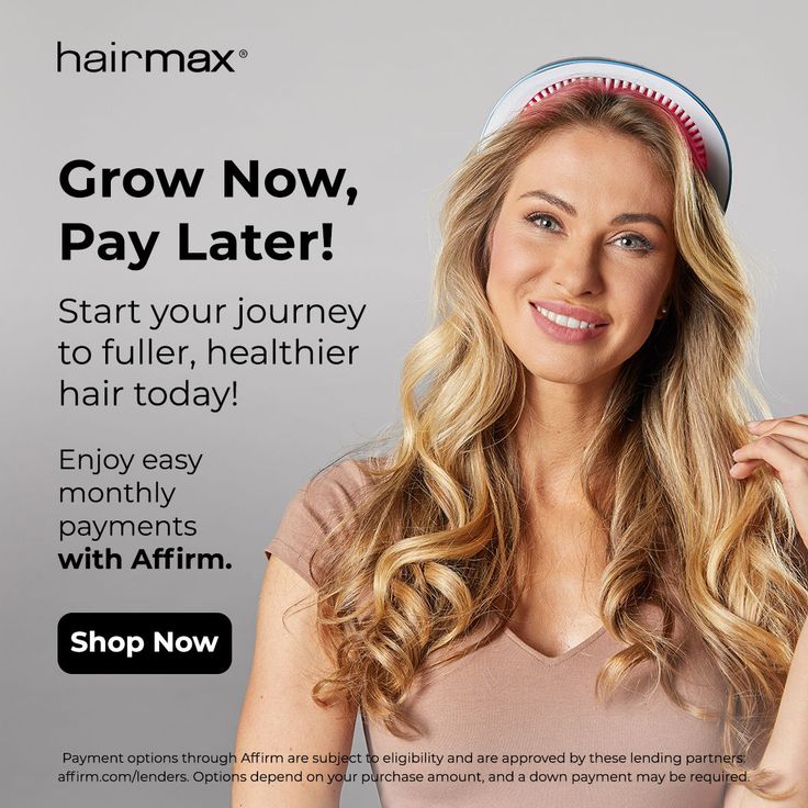 Blonde woman with long curly hair wearing a hair growth device