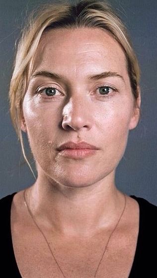Woman with blonde hair and a black top in a close-up portrait