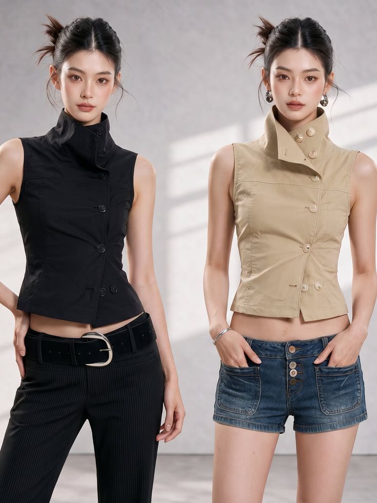 Two women posing in sleeveless tops, one in black pants and the other in denim shorts