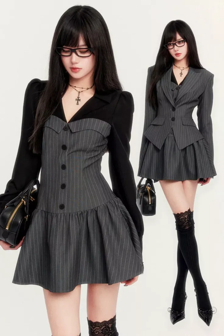 Woman in a pinstripe dress and black top with glasses and a handbag