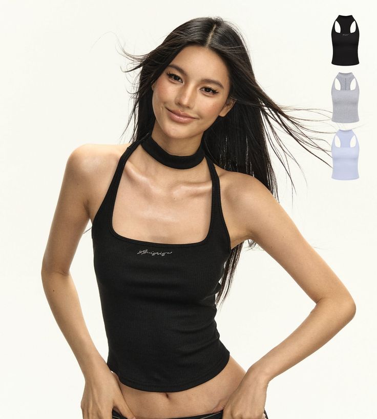 Woman with long hair wearing a black halter top and choker in a studio