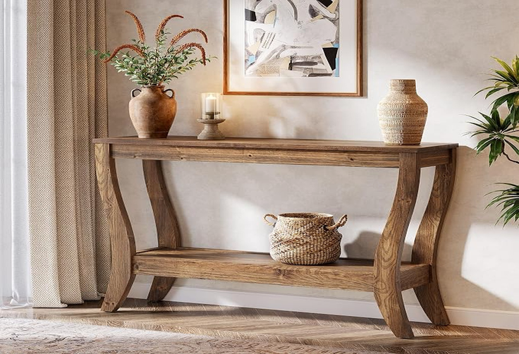 Wooden console table with decorative items in a warm-toned indoor setting