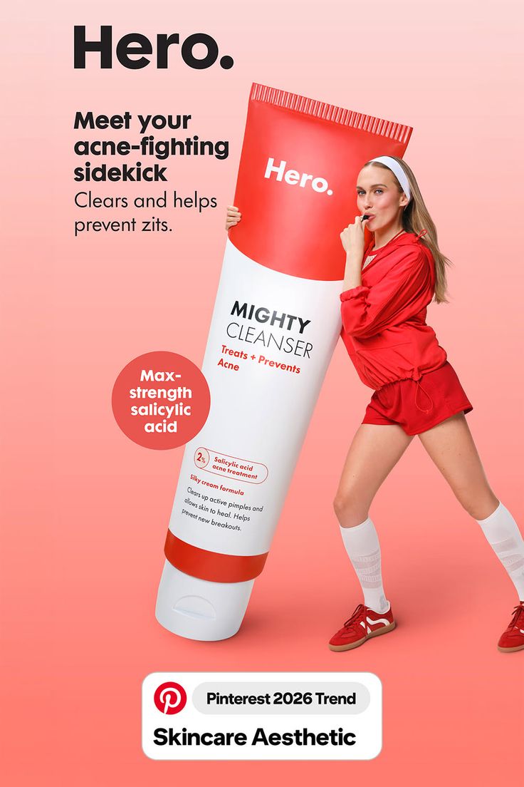 Woman in red athletic wear holding a large tube of Mighty Cleanser