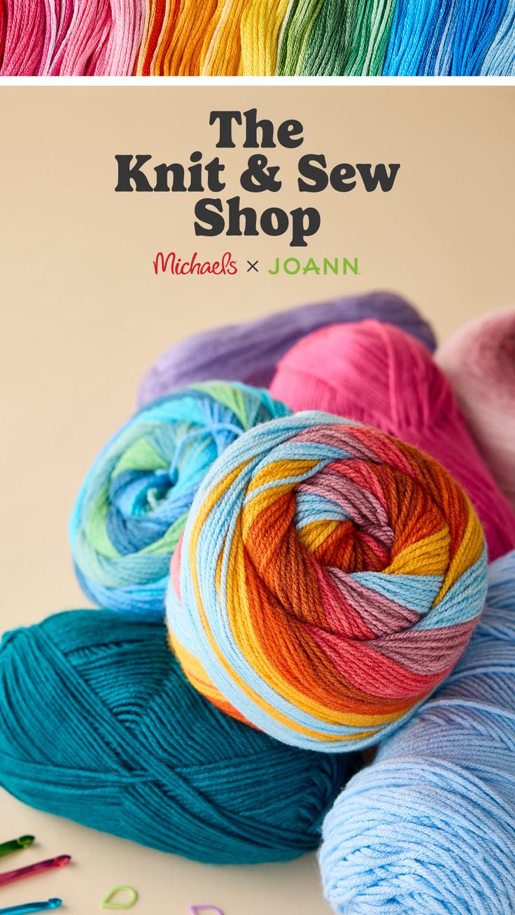 Colorful yarn skeins and knitting supplies on a light background
