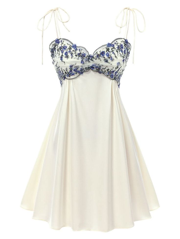White mini dress with blue floral embroidery and tie spaghetti straps