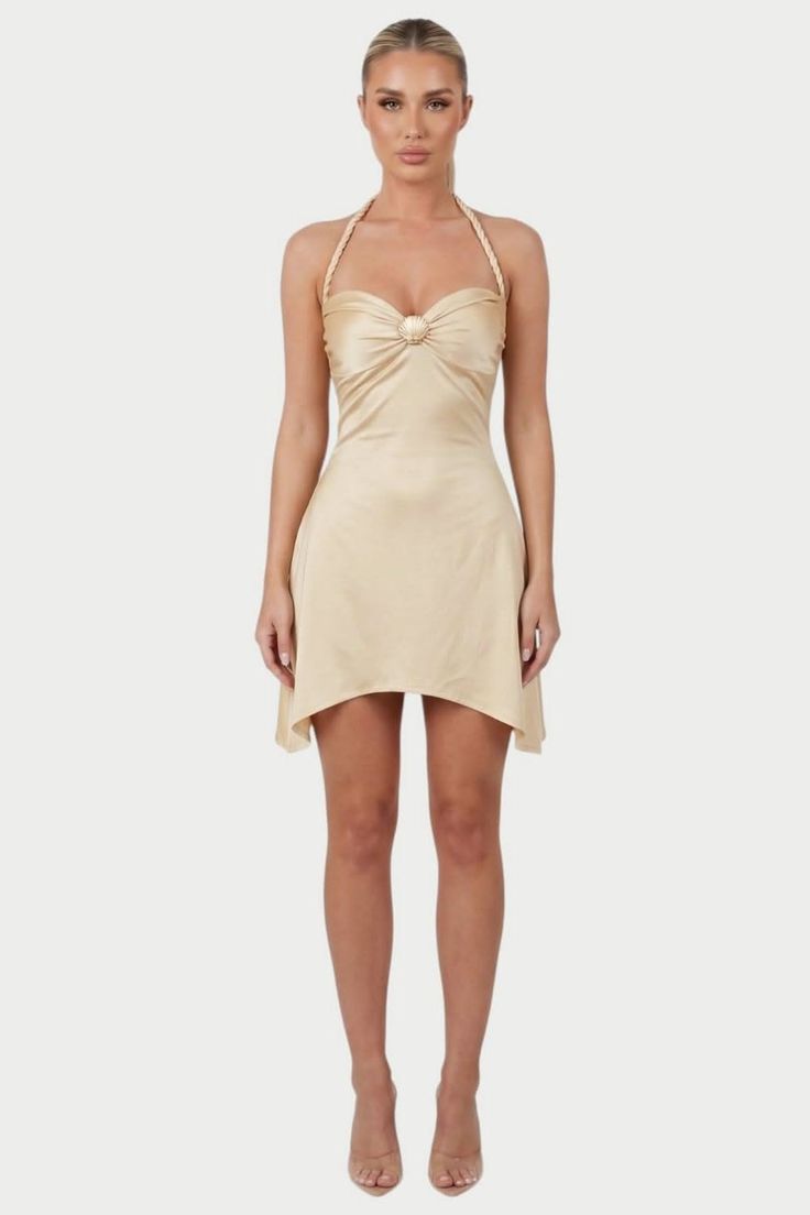 Woman in a champagne mini dress with a braided halter neckline