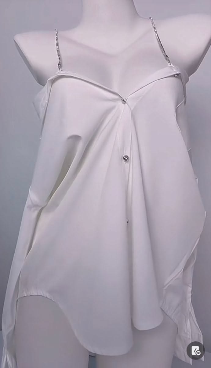 White off-shoulder shirt with rhinestone straps on a mannequin
