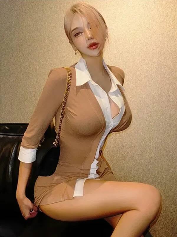 Woman with blonde hair in a short dress with cleavage and exposed skin