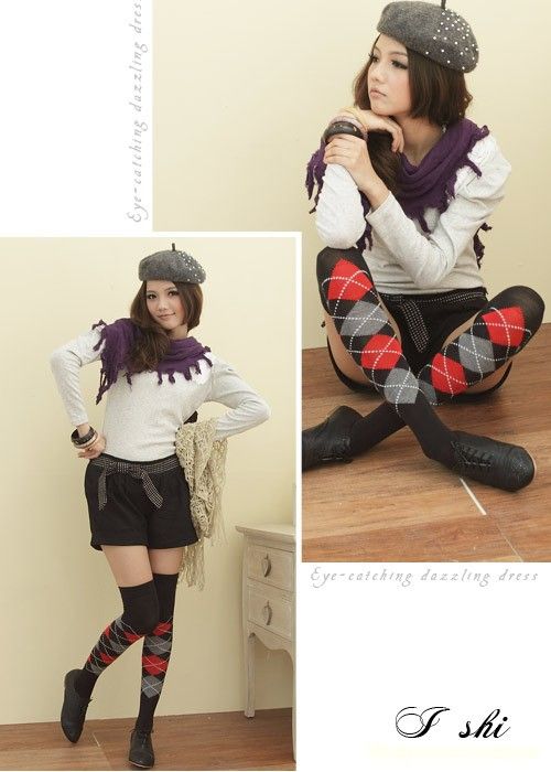 Woman in a beret, shorts, and argyle socks posing indoors