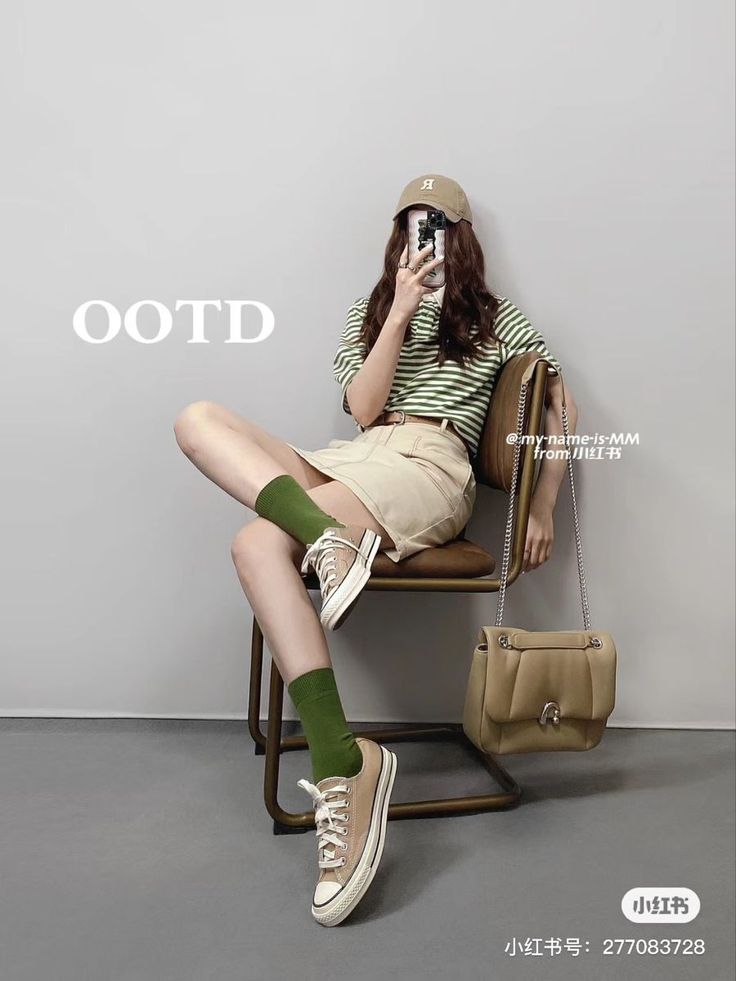 Woman in a striped shirt and mini skirt with a baseball cap and shoulder bag
