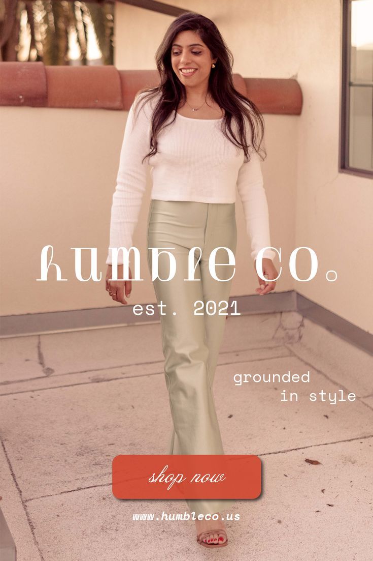 Woman with long dark hair wearing a white top and light green pants outdoors