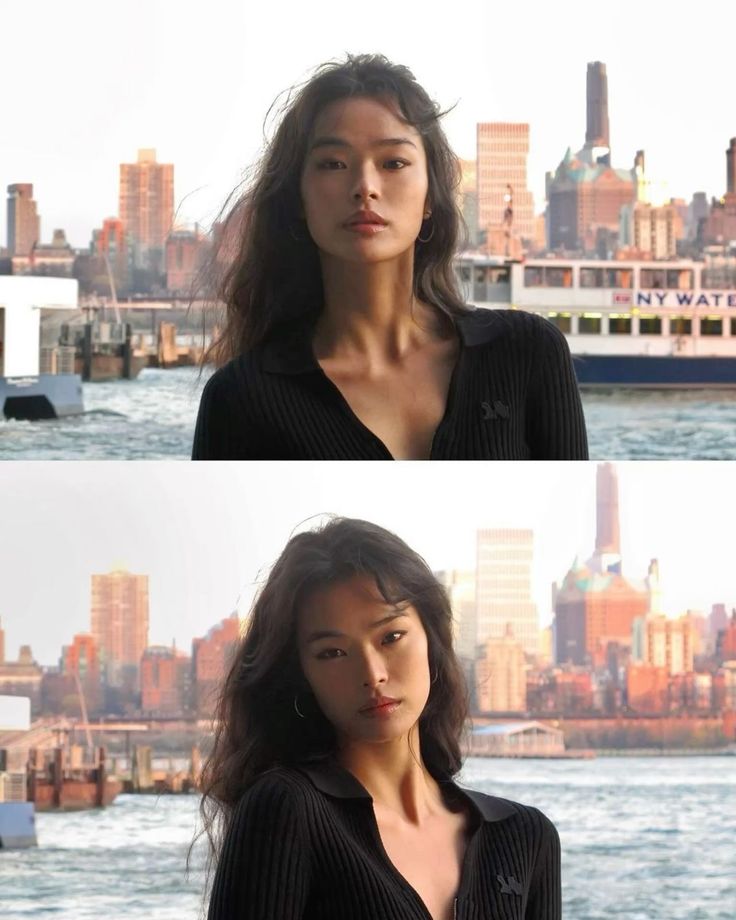 Woman with long dark hair in a black top against a city skyline and water