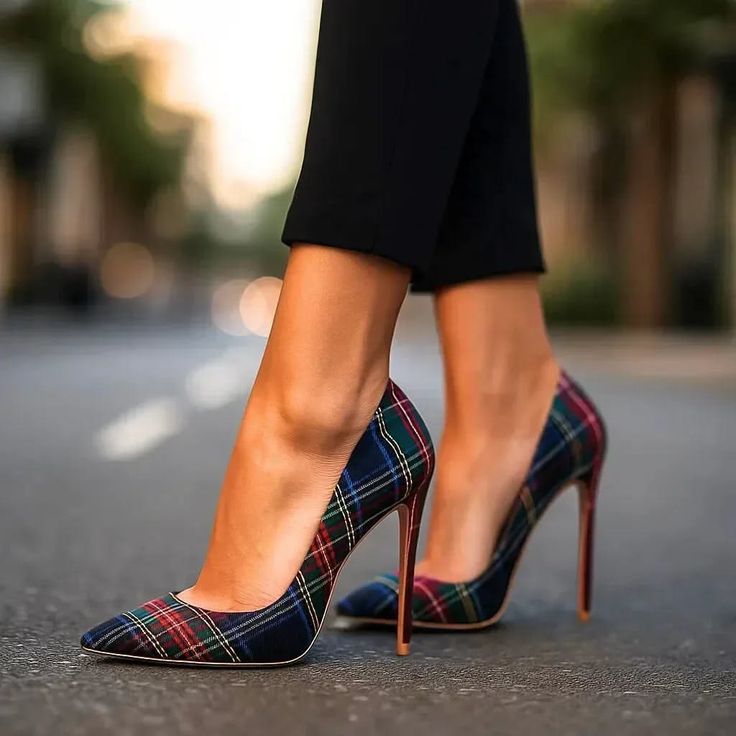 Person wearing plaid high heels and black pants outdoors